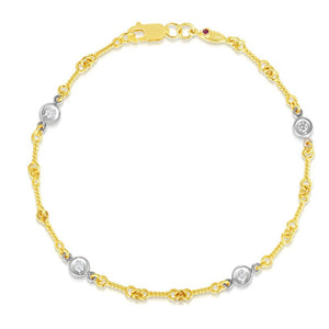 18k yellow/white diamonds by the inch four station dog bone bracele...