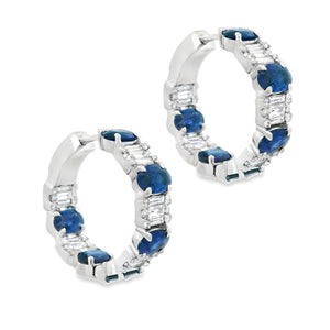 These gorgeous 18k white gold hoop earrings feature 90 round brilli...