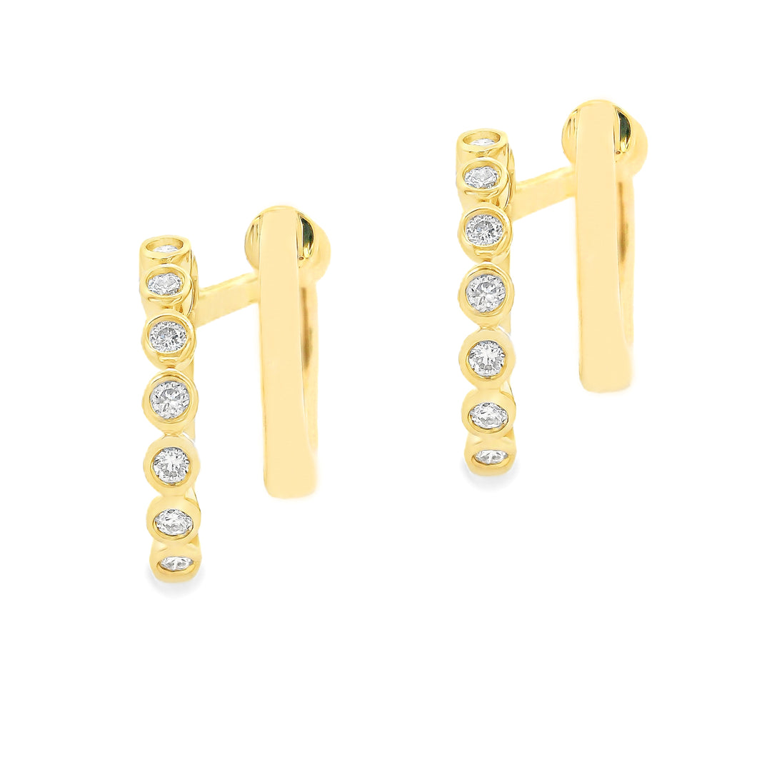 These small 14k yellow gold double hoop earrings feature bezel-set ...