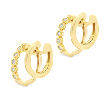 These small 14k yellow gold double hoop earrings feature bezel-set ...