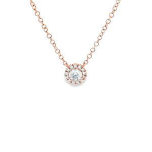 This mini 18k rose gold pendant features round brilliant cut diamon...