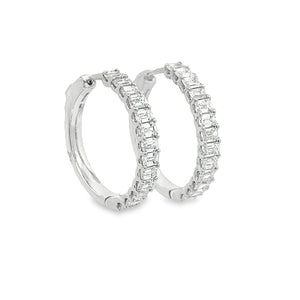 These beautiful diamond hoop earrings feature diamonds totaling app...