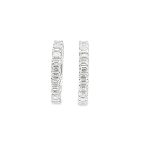 These beautiful diamond hoop earrings feature diamonds totaling app...