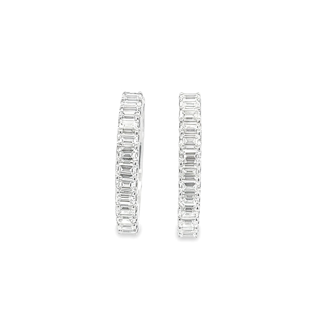 These beautiful diamond hoop earrings feature diamonds totaling app...