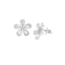 These 18k white gold diamond studs feature baguette and round brill...