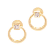 These 14k yellow gold stud circle earrings feature baguette cut dia...