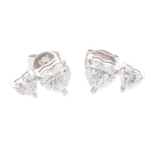 These lovely 18k white gold stud earrings feature 4 heart shaped di...