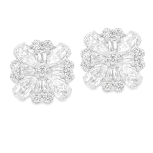 These beautiful 18k white gold diamond earrings by Christopher Desi...