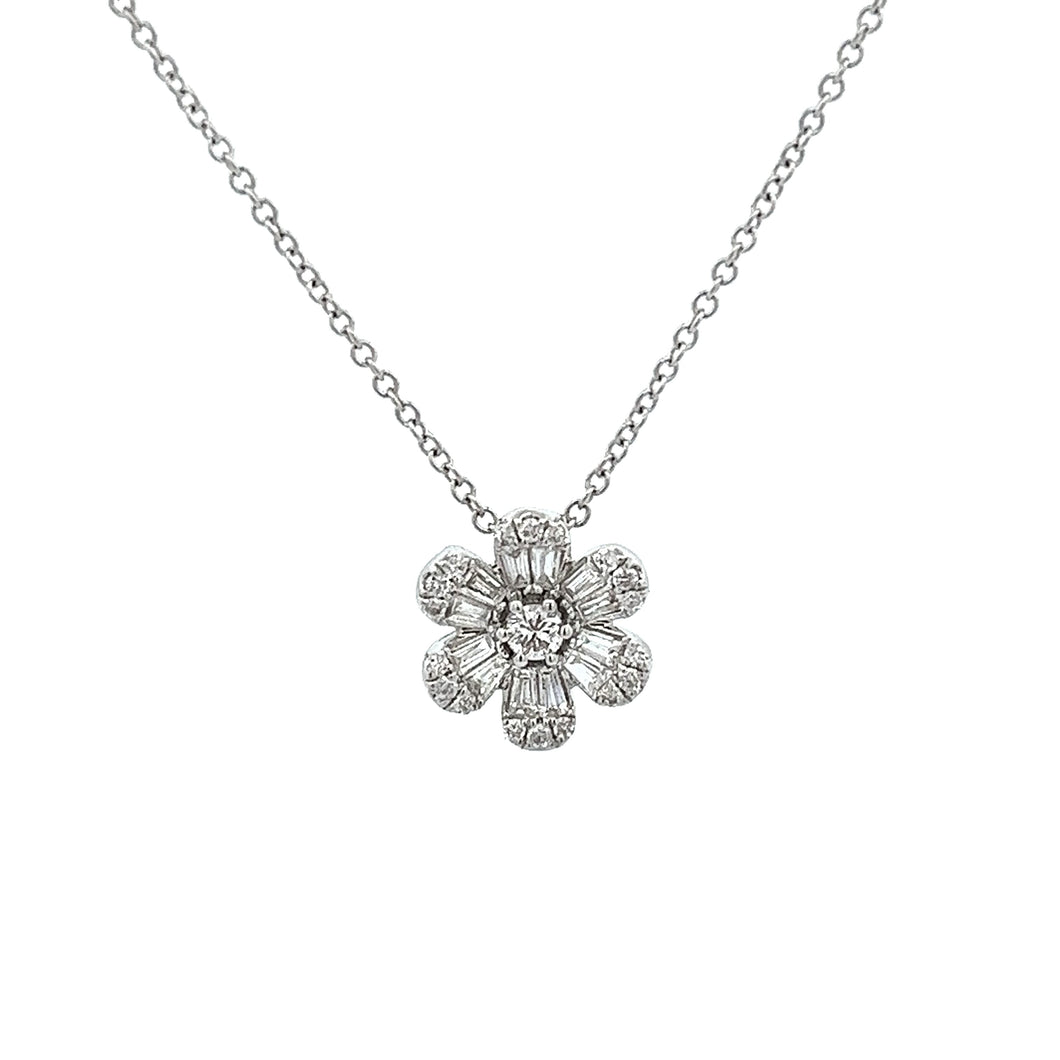 This 18k white gold flower pendant features baguette and round bril...