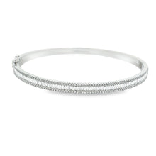 This easy to stack and style bangle features round brilliant cut an...