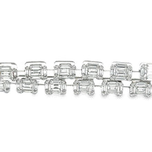 This stunning 18k white gold bracelet features a double row of roun...