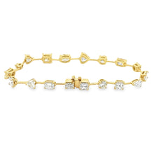 This stunning 18k yellow gold bracelet features various shapes of d...