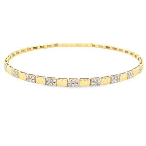 This easy to stack and style 18k yellow gold bangle features 54 rou...