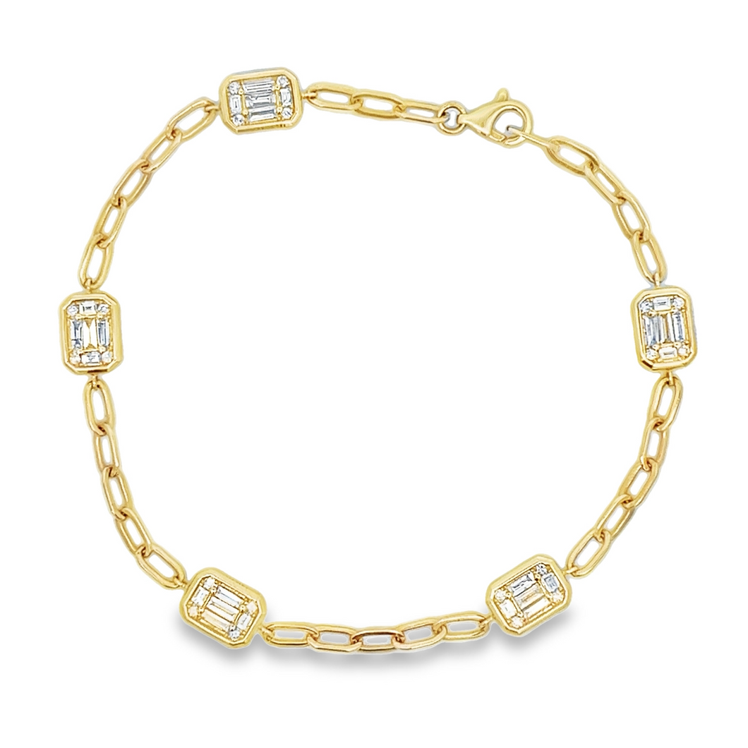 This beautiful 14k yellow gold bracelet features baguette and round...