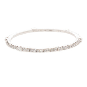 This 18k white gold diamond stretch bracelet features various shape...