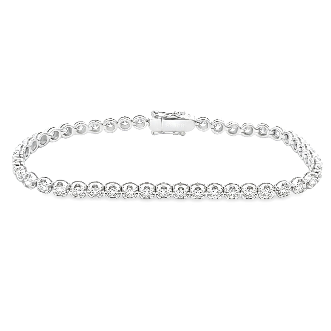 This 14k white gold diamond bracelet features round brilliant cut d...