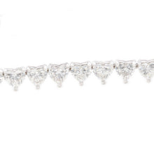 This lovely 18k white gold diamond bracelet features 44 heart shape...