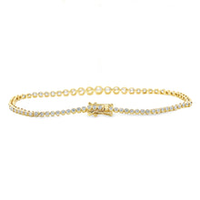 This beautiful 14k yellow gold bracelet features 75 bezel-set round...