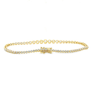 This beautiful 14k yellow gold bracelet features 75 bezel-set round...