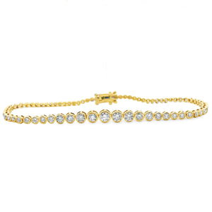 This beautiful 14k yellow gold bracelet features 75 bezel-set round...