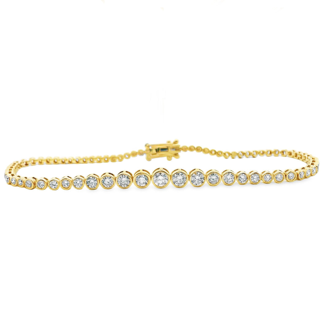 This beautiful 14k yellow gold bracelet features 75 bezel-set round...