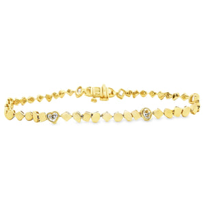 This beautiful 14k yellow gold bracelet features 6 mixed shaped dia...