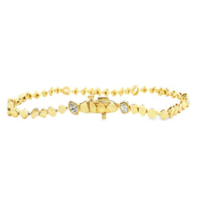 This beautiful 14k yellow gold bracelet features 6 mixed shaped dia...