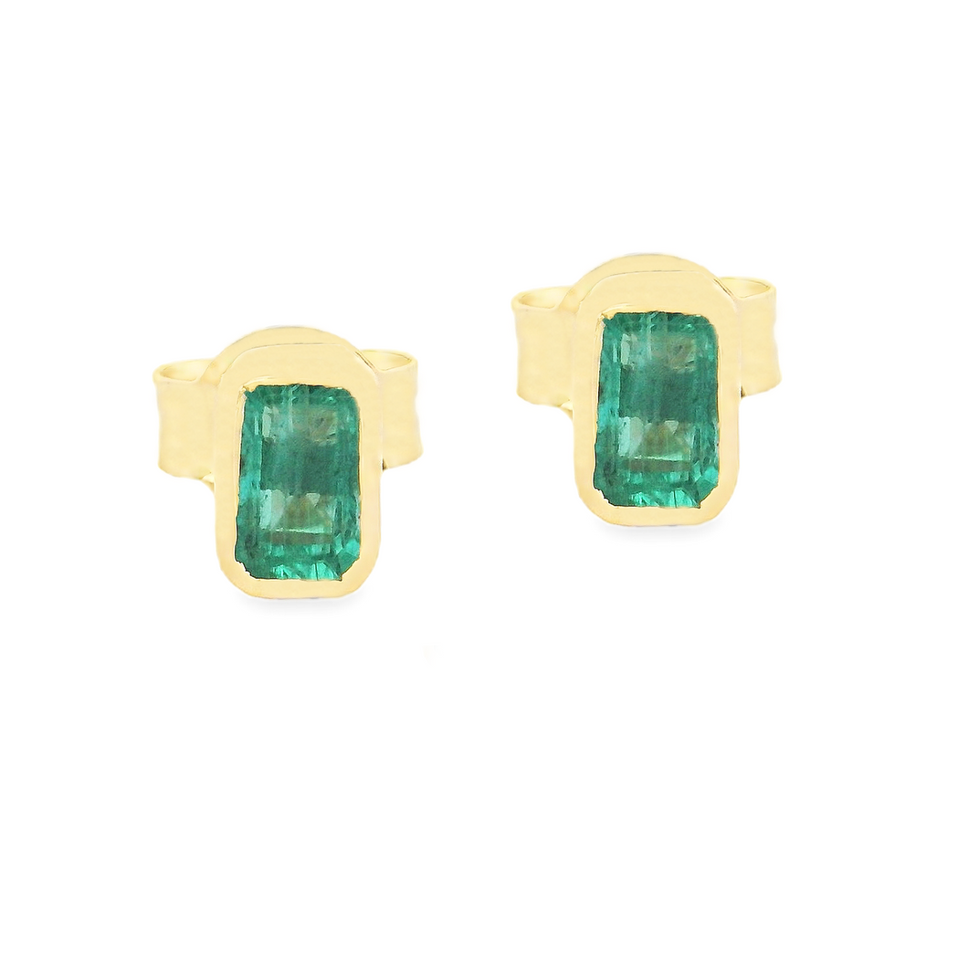 18k yellow gold dainty earrings that feature 2 gorgeous emeralds. T...