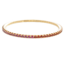 This 18k yellow gold stretch bracelet features various colors of sa...