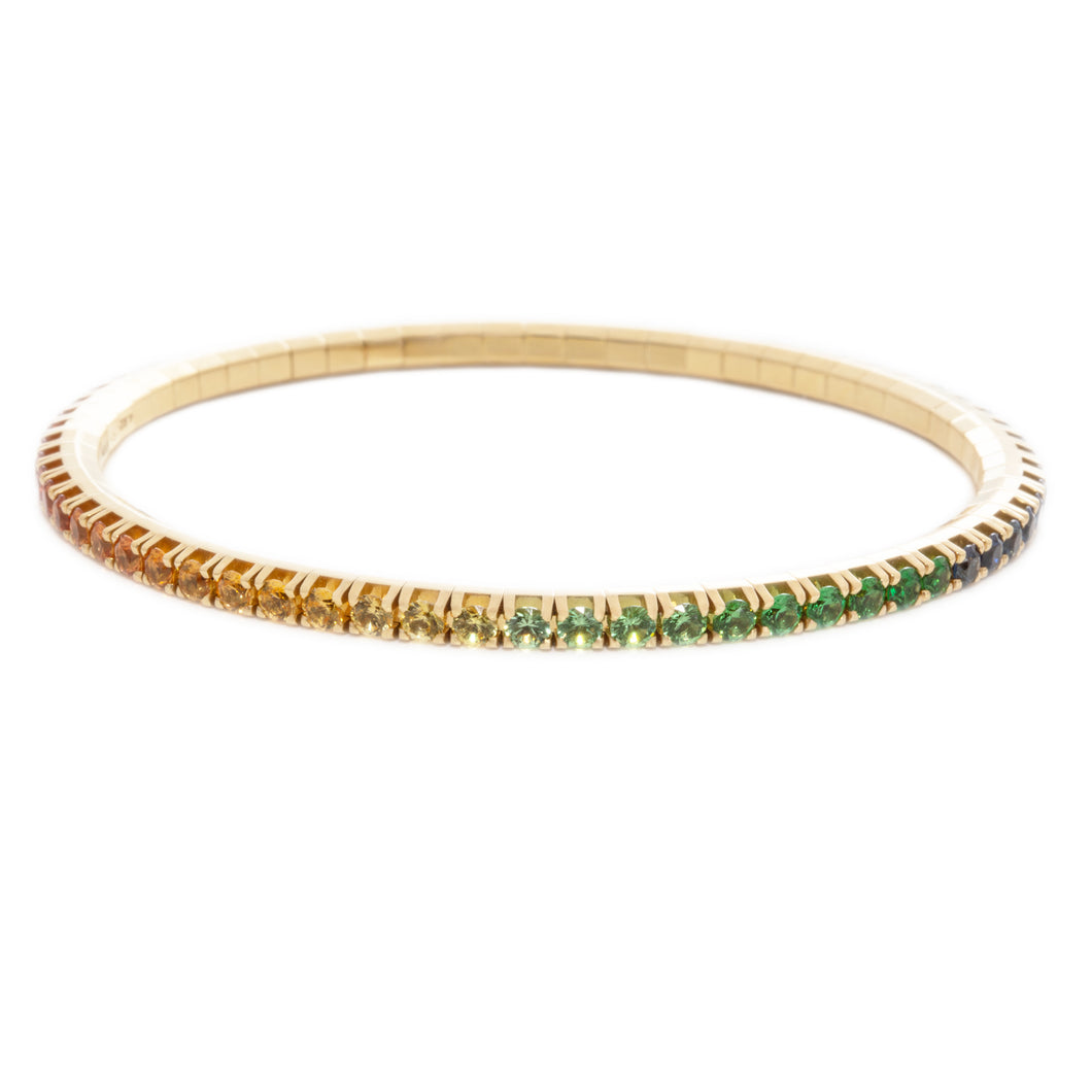 This 18k yellow gold stretch bracelet features various colors of sa...