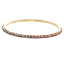 This 18k yellow gold stretch bracelet features various colors of sa...