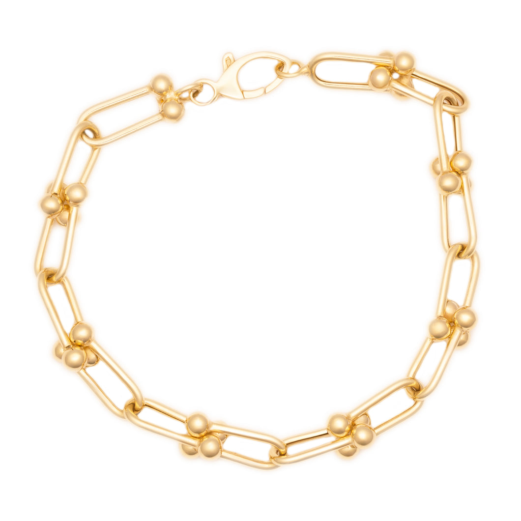 This unique 14k yellow gold bracelet features link chain, ball bear...