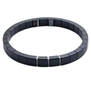 This Men's 18k white gold matte black ceramic stretch bracelet from...