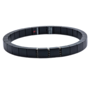 This Men's 18k white gold matte black ceramic stretch bracelet from...