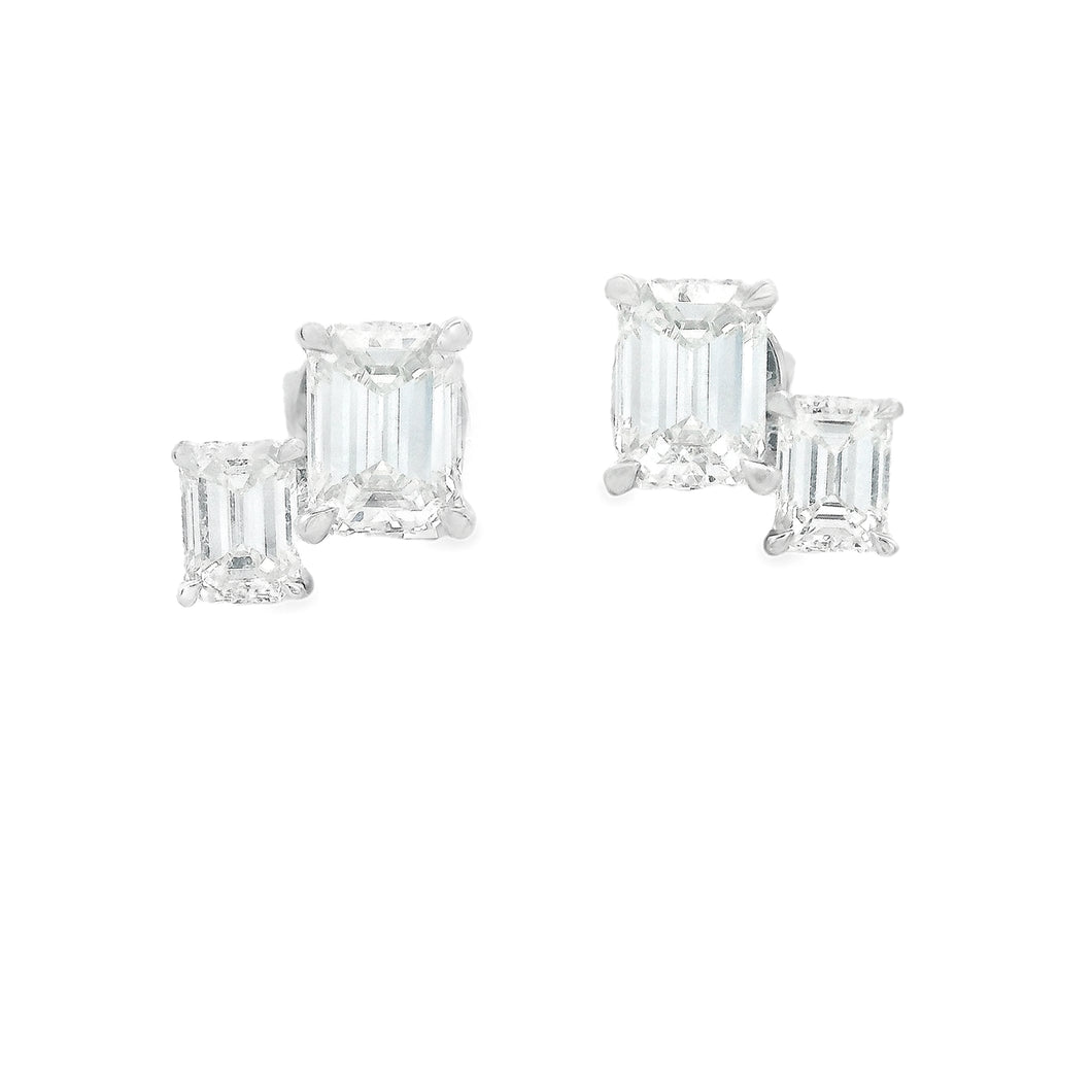 These dainty yet beautiful 18k white gold earrings feature 4 emeral...