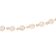 This easy to style 14k yellow gold bracelet features bezel set diam...