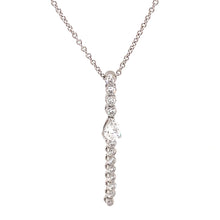 This diamond stick pendant necklace features a pear shape and round...