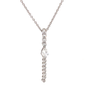 This diamond stick pendant necklace features a pear shape and round...
