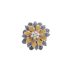 This estate ring features diamonds that total .70cts along wth blue...