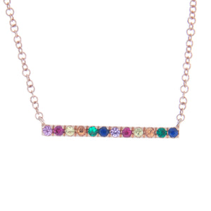 Easy to layer rose gold necklace featuring rainbow gemstones on a s...