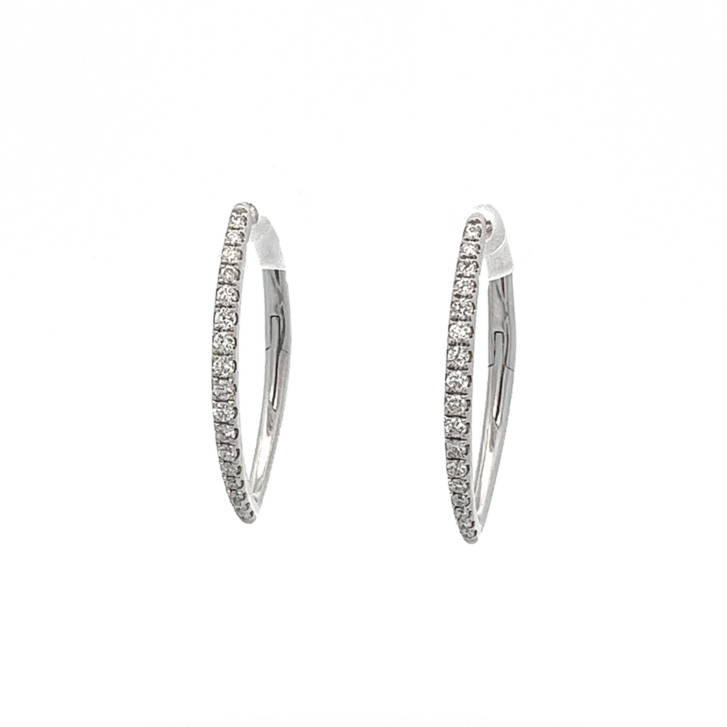 These 14k white gold diamond hoops feature round brilliant cut diam...