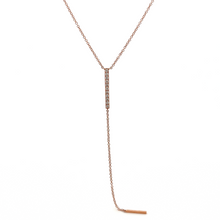 This lariat necklace features 11 round brilliant cut diamonds total...