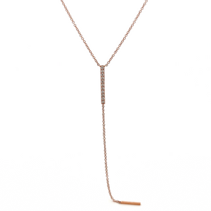 This lariat necklace features 11 round brilliant cut diamonds total...