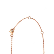 This lariat necklace features 11 round brilliant cut diamonds total...