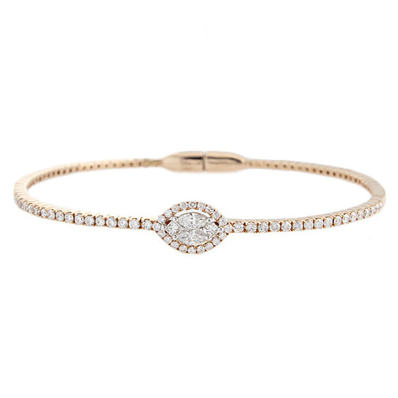 This bangle features pave set round brilliant cut diamonds with a c...