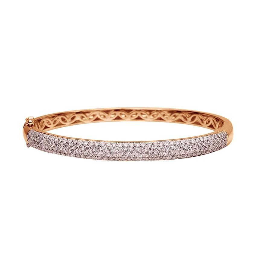 This diamond bangle features pave set round brilliant cut diamonds ...