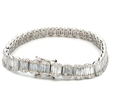 This stunning 14k white gold diamond bracelet features baguette cut...