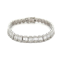 This stunning 14k white gold diamond bracelet features baguette cut...