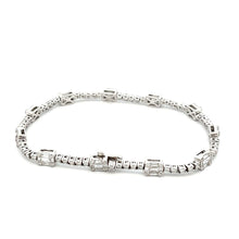 This gorgeous 18k white gold diamond bracelet features 55 baguette ...