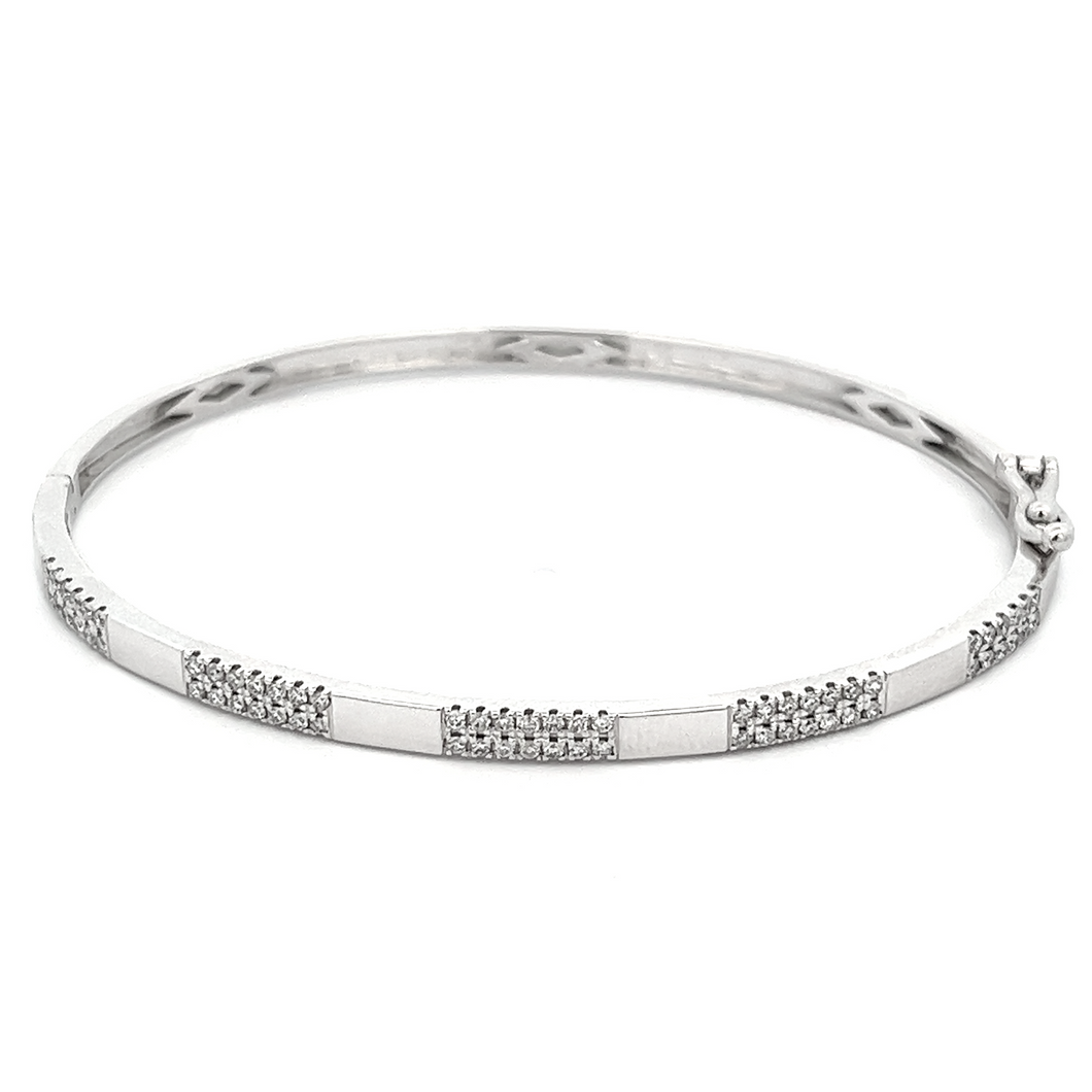 This easy to stack and style 14k white gold bangle features pave-se...